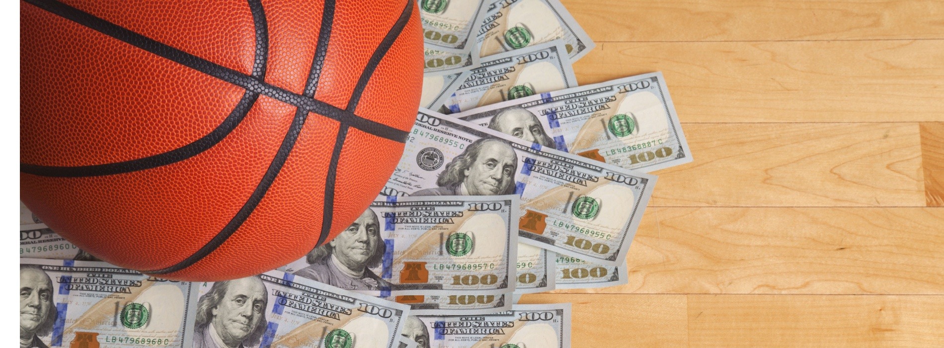 basketball on a pile of US money